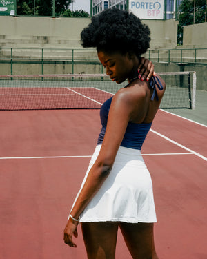Full back view of white ace flare tennis skirt sport vervewear