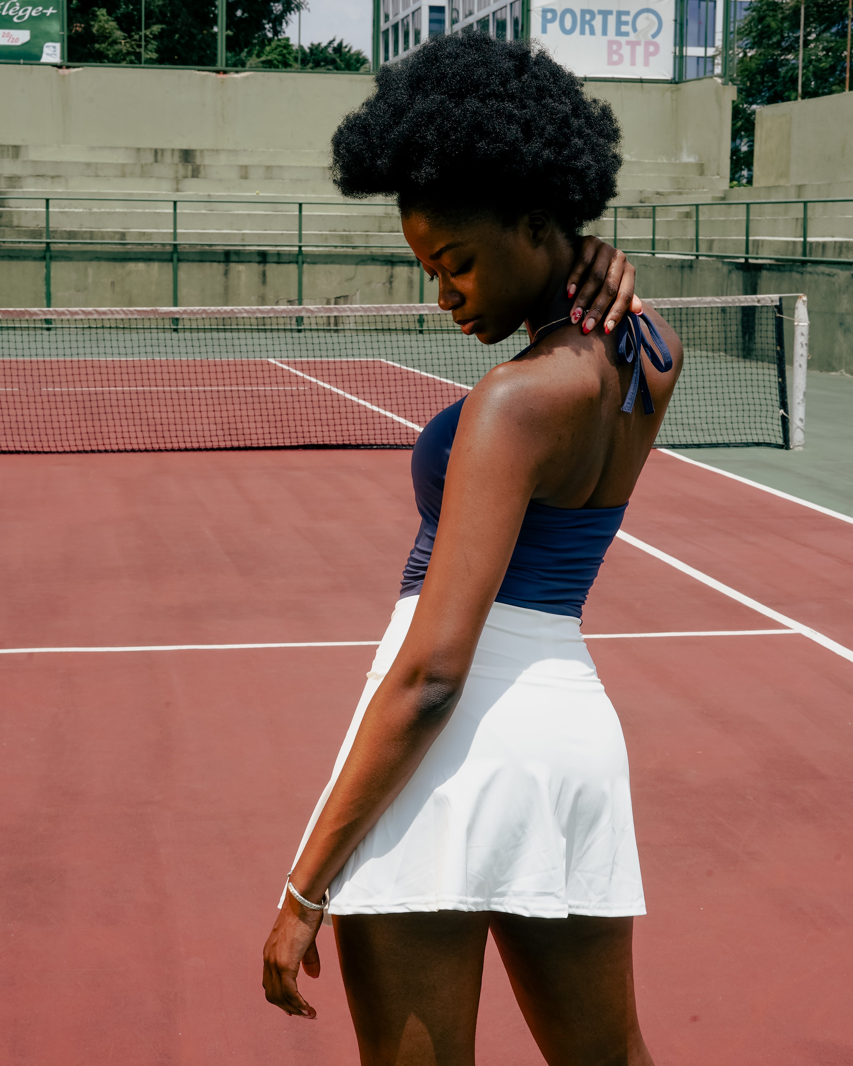 Full back view of white ace flare tennis skirt sport vervewear